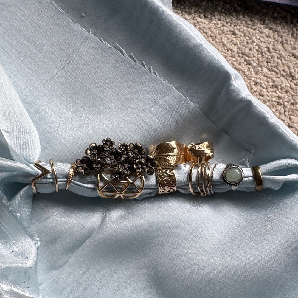 Gold and Silver Mixed Metal Ring Set on Pale Blue Satin Scarf
